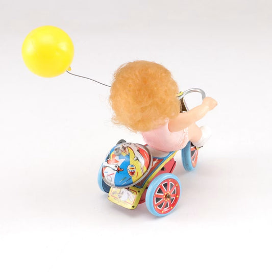 Vintage Made in Japan Wind-Up Girl on Tricycle Tin Toy with Balloon & Bell