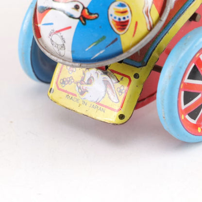 Vintage Made in Japan Wind-Up Girl on Tricycle Tin Toy with Balloon & Bell