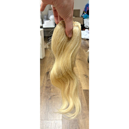 Irresistible Me 100% human hair clip-in extensions in shade #613 Blonde.